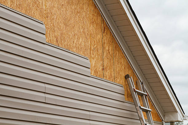 Professional Storm Damage Siding Repair technician working in Vandalia, IL